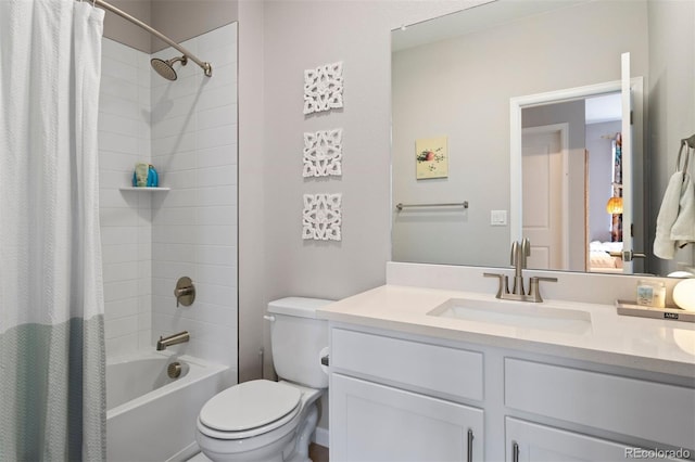 full bathroom with vanity, shower / bath combination with curtain, and toilet