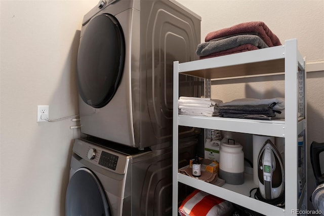 laundry area with stacked washer / drying machine