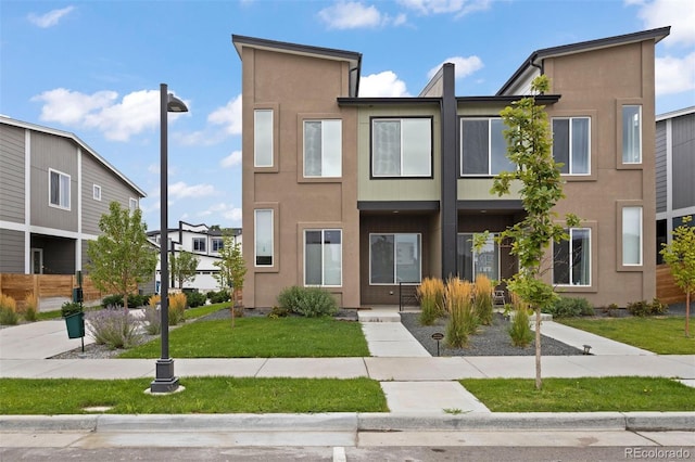 view of front of home with a front lawn