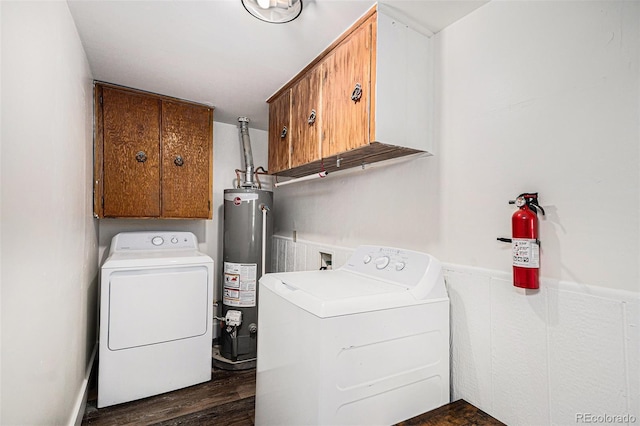 1293 S Perry St, Denver, CO 80219 - washroom with cabinet space, gas water heater, washer and dryer, wainscoting, and dark wood-style floors