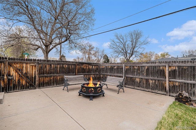 1293 S Perry St, Denver, CO 80219 - fenced backyard featuring an outdoor fire pit and a patio area