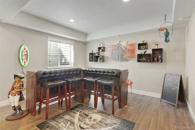 bar with baseboards, hardwood / wood-style floors, and recessed lighting