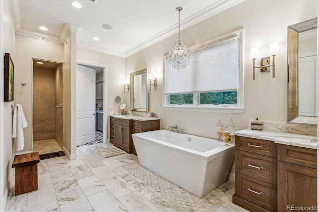 bathroom with a tub to relax in, ornamental molding, tile patterned floors, and vanity