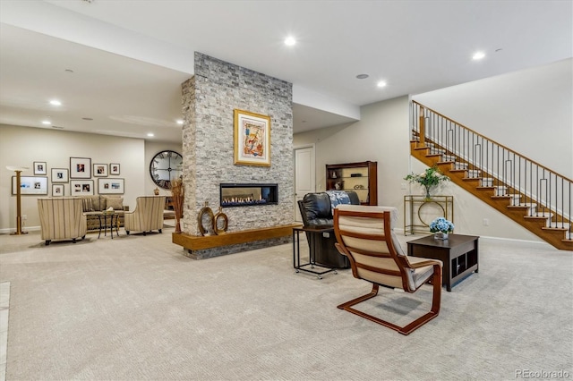 living room featuring a fireplace and light carpet