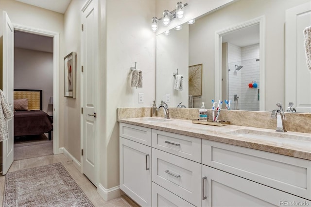 bathroom featuring double vanity, walk in shower, and tile patterned flooring