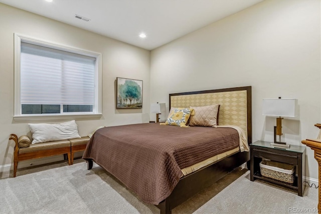 bedroom featuring recessed lighting, visible vents, light carpet, and baseboards