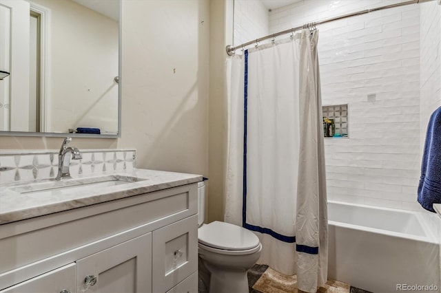 full bath with toilet, shower / bath combo, and vanity