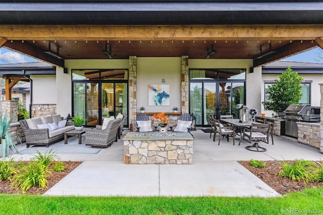 view of patio / terrace featuring an outdoor hangout area, a grill, a ceiling fan, exterior kitchen, and outdoor dining space