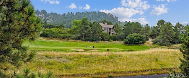 surrounding community featuring view of golf course