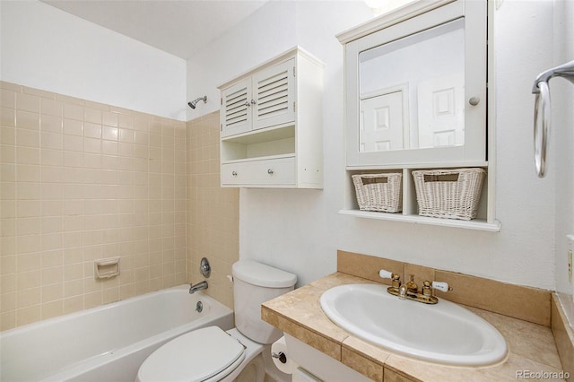 full bathroom with tiled shower / bath combo, vanity, and toilet