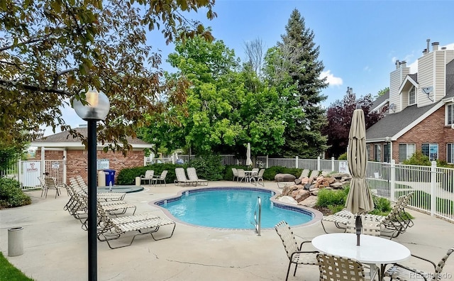 view of pool featuring a patio