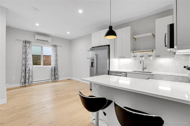 kitchen featuring a wall mounted air conditioner, light countertops, decorative backsplash, appliances with stainless steel finishes, and open shelves