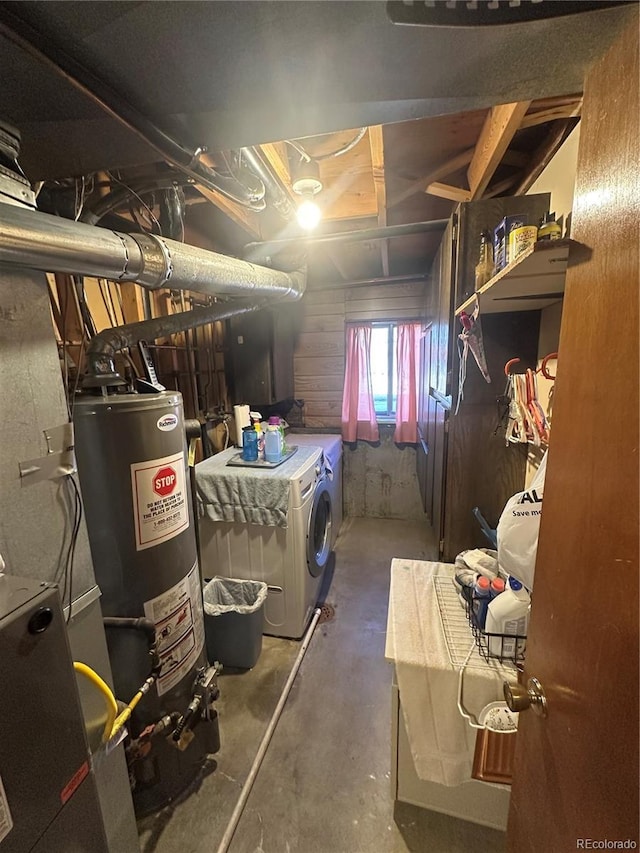 below grade area featuring separate washer and dryer and water heater