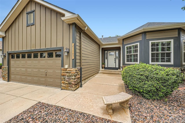 21107 Hawthorne Ln, Parker, CO 80138 - view of front of home with board and batten siding, an attached garage, stone siding, and concrete driveway