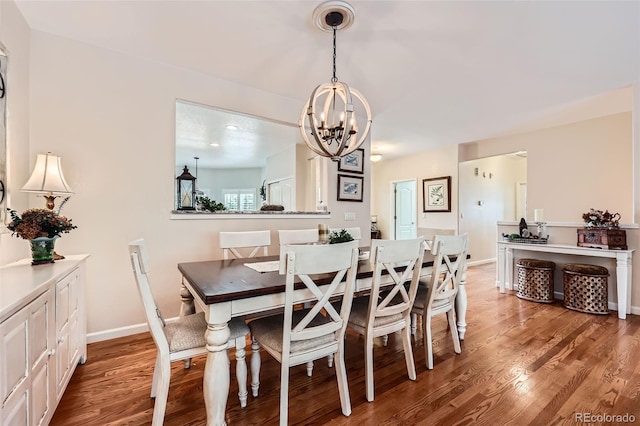 21107 Hawthorne Ln, Parker, CO 80138 - dining space with a chandelier and light wood-style flooring