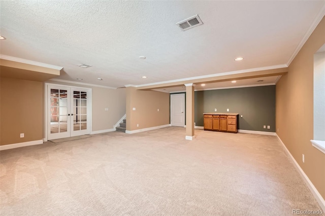 21107 Hawthorne Ln, Parker, CO 80138 - finished below grade area featuring ornamental molding, recessed lighting, french doors, light carpet, and stairway