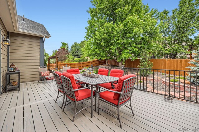 21107 Hawthorne Ln, Parker, CO 80138 - deck with outdoor dining space and a fenced backyard