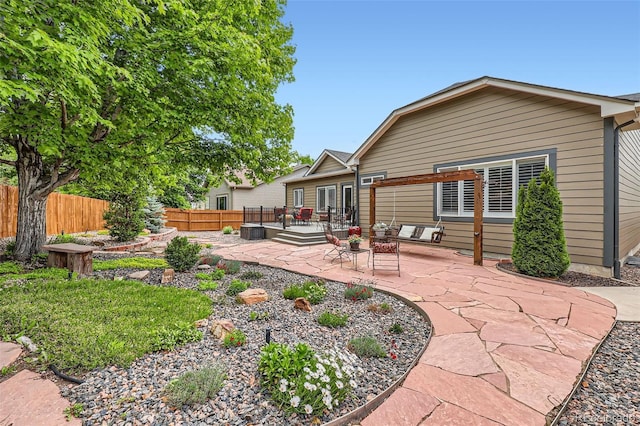 21107 Hawthorne Ln, Parker, CO 80138 - back of house featuring a patio and a wooden deck