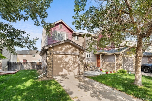 view of front of house with a front lawn and a garage