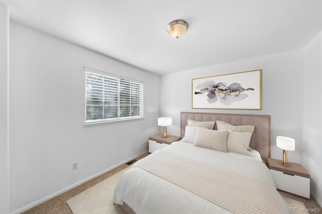 bedroom with light colored carpet