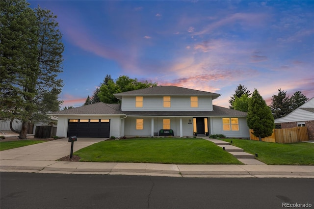5853 S Havana Ct, Englewood, CO 80111 - view of front of house with concrete driveway, a garage, and covered porch