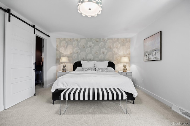 5853 S Havana Ct, Englewood, CO 80111 - bedroom featuring a barn door, carpet, baseboards, and wallpapered walls