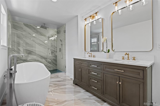 5853 S Havana Ct, Englewood, CO 80111 - bathroom with marble tiled flooring, a marble finish shower, double vanity, and a freestanding bath