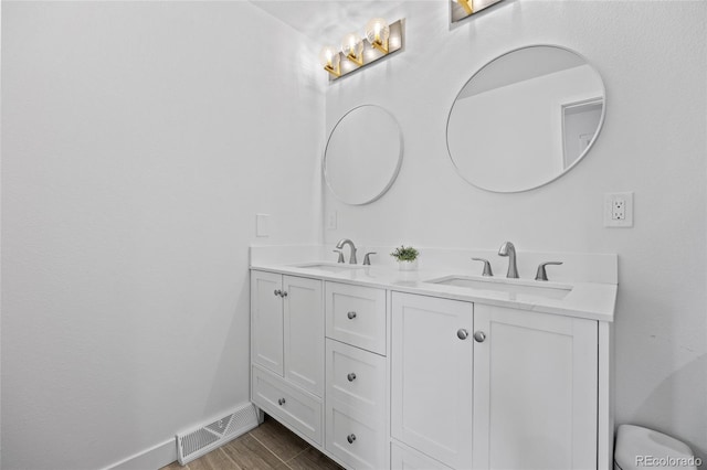 5853 S Havana Ct, Englewood, CO 80111 - full bathroom with double vanity and baseboards