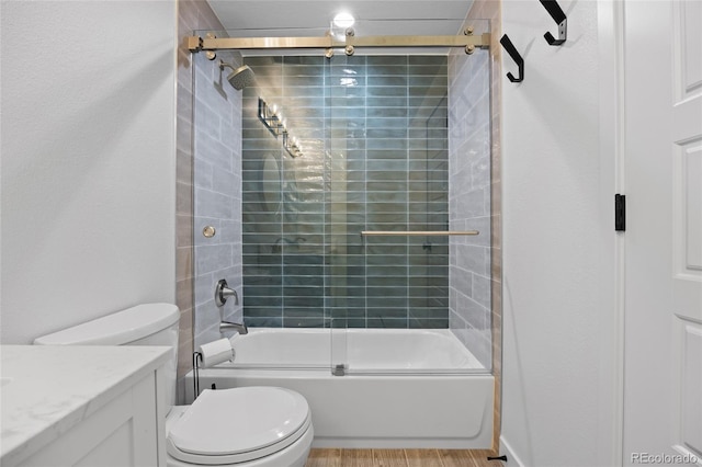 5853 S Havana Ct, Englewood, CO 80111 - full bath featuring toilet, vanity, combined bath / shower with glass door, and wood finished floors