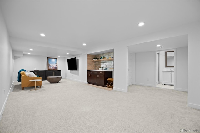 5853 S Havana Ct, Englewood, CO 80111 - living room with light colored carpet, bar area, recessed lighting, and baseboards