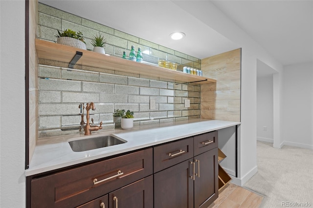 5853 S Havana Ct, Englewood, CO 80111 - bar with a sink, decorative backsplash, and baseboards
