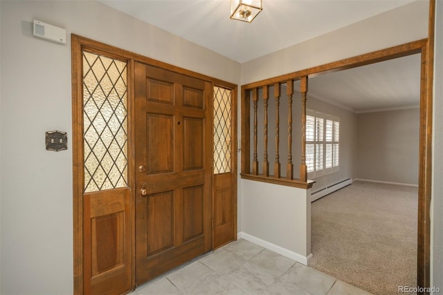 foyer entrance with light carpet, a baseboard heating unit, crown molding, light tile patterned floors, and baseboards