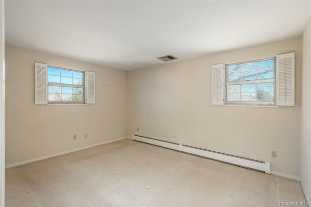 spare room with visible vents, carpet flooring, baseboards, and a baseboard radiator