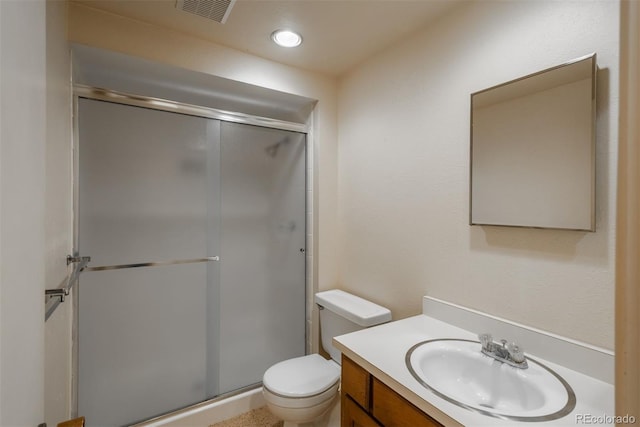 bathroom with visible vents, a shower stall, toilet, recessed lighting, and vanity