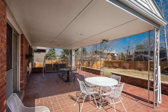 view of patio / terrace featuring outdoor dining space and a fenced backyard