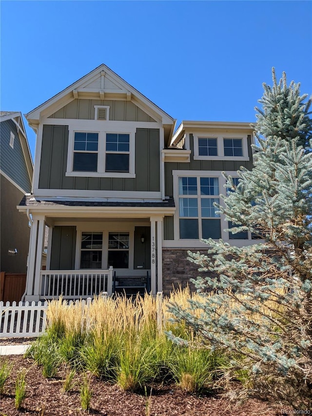 13788 Umatilla Ln, Broomfield, CO 80023 - view of front of house with board and batten siding and covered porch