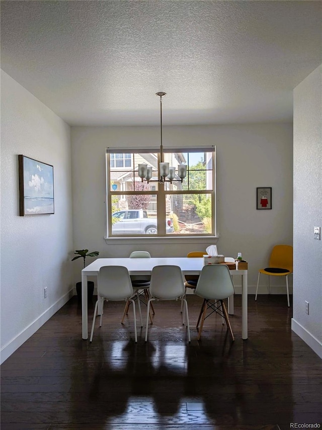 13788 Umatilla Ln, Broomfield, CO 80023 - dining room with wood-type flooring, a textured ceiling, and a chandelier