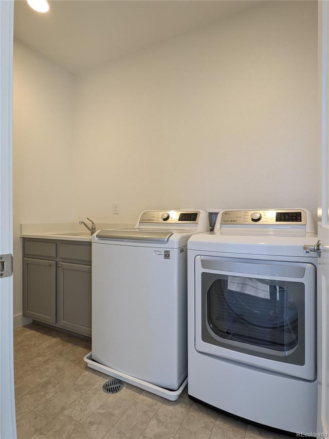 13788 Umatilla Ln, Broomfield, CO 80023 - washroom featuring washing machine and dryer and cabinet space