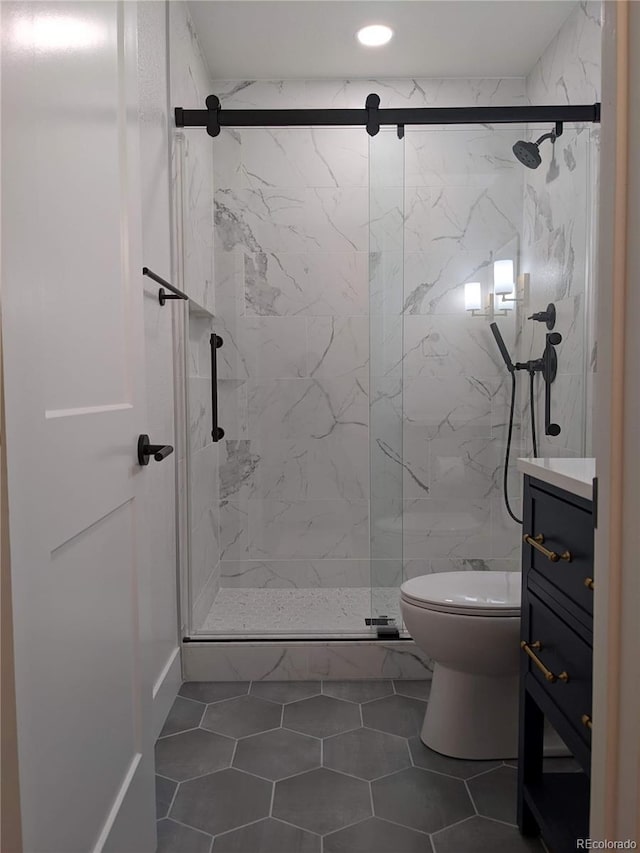 13788 Umatilla Ln, Broomfield, CO 80023 - bathroom featuring a marble finish shower, vanity, recessed lighting, and tile patterned floors