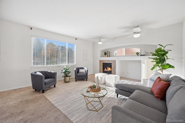 carpeted living room featuring ceiling fan