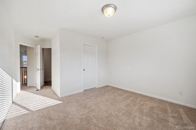 unfurnished bedroom with light colored carpet