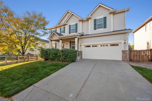 craftsman-style home featuring a garage and a front lawn