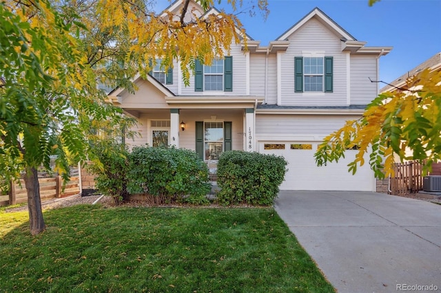 view of front of house featuring a front lawn and a garage