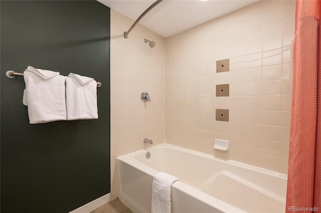 bathroom with shower / bath combination with curtain