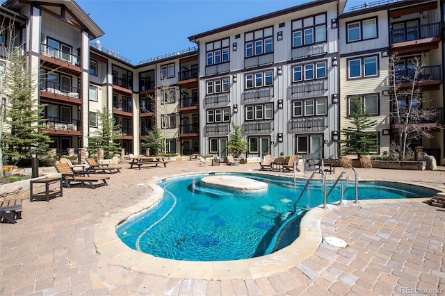 view of swimming pool with a patio area