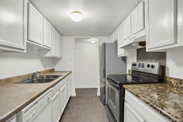 9995 E Harvard Ave Unit 290, Denver, CO 80231 - kitchen with appliances with stainless steel finishes, under cabinet range hood, white cabinets, a sink, and a textured ceiling