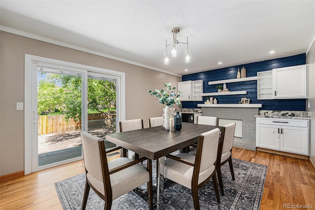 8712 W 64th Way, Arvada, CO 80004 - dining space featuring light wood-style floors, crown molding, and recessed lighting