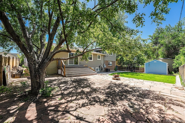 8712 W 64th Way, Arvada, CO 80004 - rear view of property with a patio area, a storage unit, and an outdoor structure