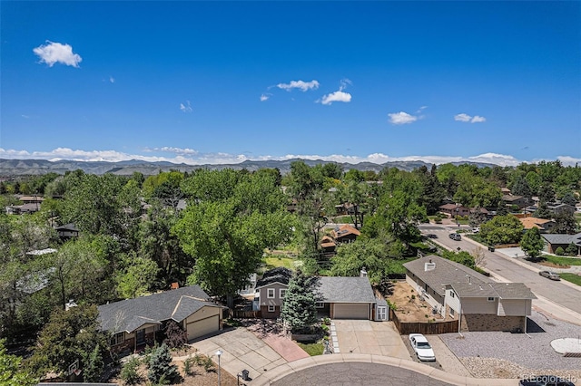 8712 W 64th Way, Arvada, CO 80004 - aerial perspective of suburban area featuring a mountain backdrop