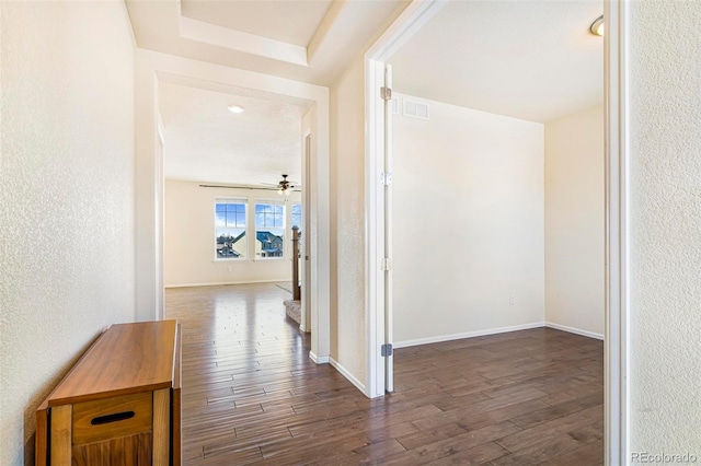 corridor featuring dark hardwood / wood-style flooring